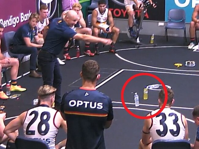 Matthew Nicks uses bottles to show the Crows what to do.