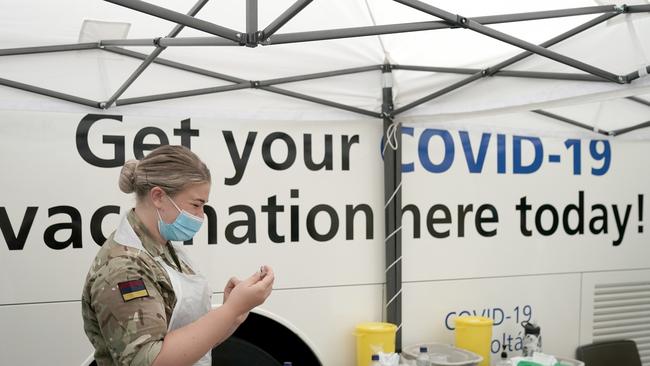 A military medic prepares a vaccine in Bolton, northwest England. Picture: Getty Images