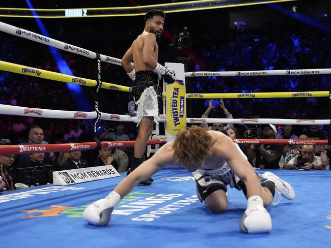 Ramon Cardenas knocks down Naoya Inoue early in Las Vegas. (AP Photo/John Locher)