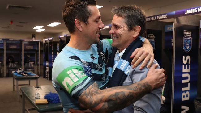 Mitchell Pearce celebrates NSW’s victory with his father Wayne Pearce. Picture: Brett Costello