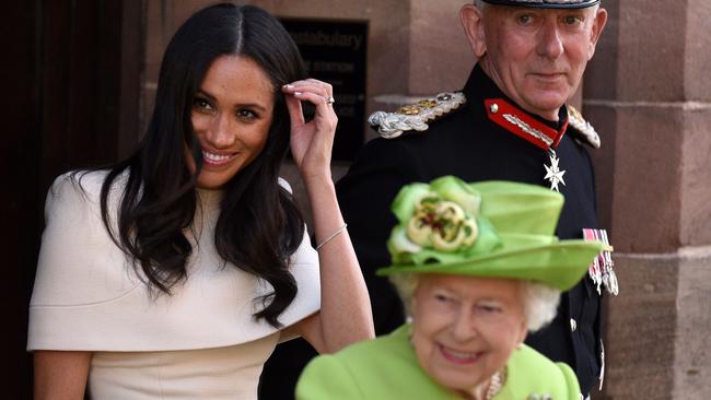 The Queen and Meghan leave Chester Town Hall during their visit to Cheshire. Picture: AFP.