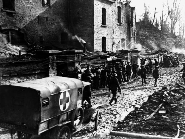 Australian soldiers walking past Red Cross truck on the Western Front in Passchendaele during World War I 1917. historical /World/War/1914/18 (Pic: Australian War Memorial)