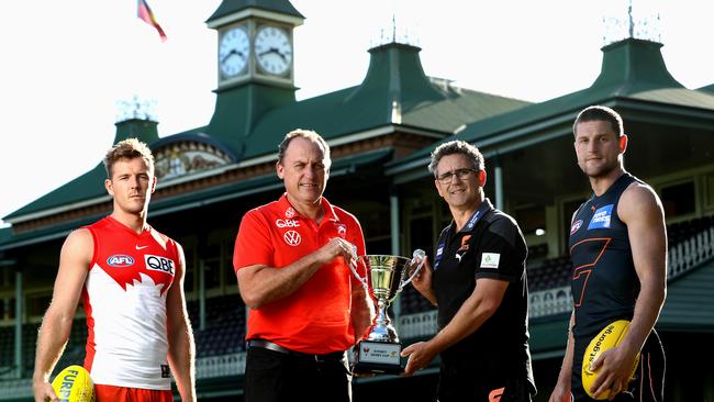 SYDNEY, AUSTRALIA – APRIL 13: (L-R) Luke Parker of the Swans, Swans Coach, John Longmire, Giants Coach, Leon Cameron and Jacob Hopper of the Giants pose for a portrait during an AFL media opportunity ahead of Sydney Derby at Sydney Cricket Ground on April 13, 2021 in Sydney, Australia. (Photo by Brendon Thorne/Getty Images)