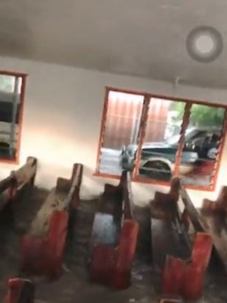 Screen grabs from footage taken inside a church in Tonga when a tsunami hit. Twitter/Johnnyteiser