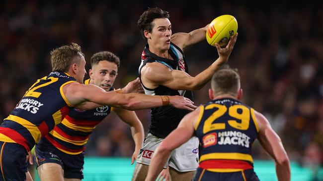 ADELAIDE, AUSTRALIA - MAY 02: Connor Rozee of the Power handpasses the ball during the 2024 AFL Round 08 match between the Adelaide Crows and the Port Adelaide Power at Adelaide Oval on May 02, 2024 in Adelaide, Australia. (Photo by Sarah Reed/AFL Photos via Getty Images)