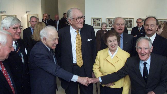 Malcolm Fraser launches his new book titled 'Common Ground' at 101 Collins st. l/r Jim Carlton, Michael McKellar, Sir Zelman Cowen, Fraser, Dame Margaret Guilfoyle, Peter Nixon (rear), Tony Street (shaking Zelman's hand) and Ian Mcphee (rear).