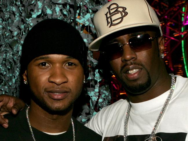 LOS ANGELES, CA - DECEMBER 01: Singer Usher and rapper/producer Sean "P. Diddy" Combs pose backstage during the VH1 Big in 04 at the Shrine Auditorium on December 1, 2004 in Los Angeles, California. (Photo by Frank Micelotta/Getty Images)