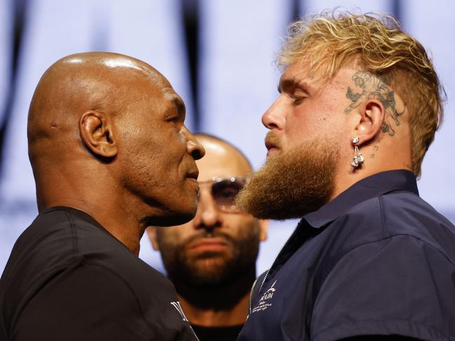 NEW YORK, NEW YORK - MAY 13: (L-R) Mike Tyson and Jake Paul speak onstage at the press conference in promotion for the upcoming Jake Paul vs. Mike Tyson boxing match at The Apollo Theater on May 13, 2024 in New York City. (Photo by Sarah Stier/Getty Images for Netflix)