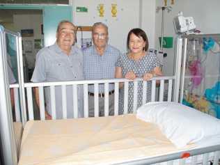 Dinny Madden (left), Jim Madden and Margaret Toleman purchased one of the cots for the pediatric unit to honour their sister who was stillborn in 1946. Picture: Contributed