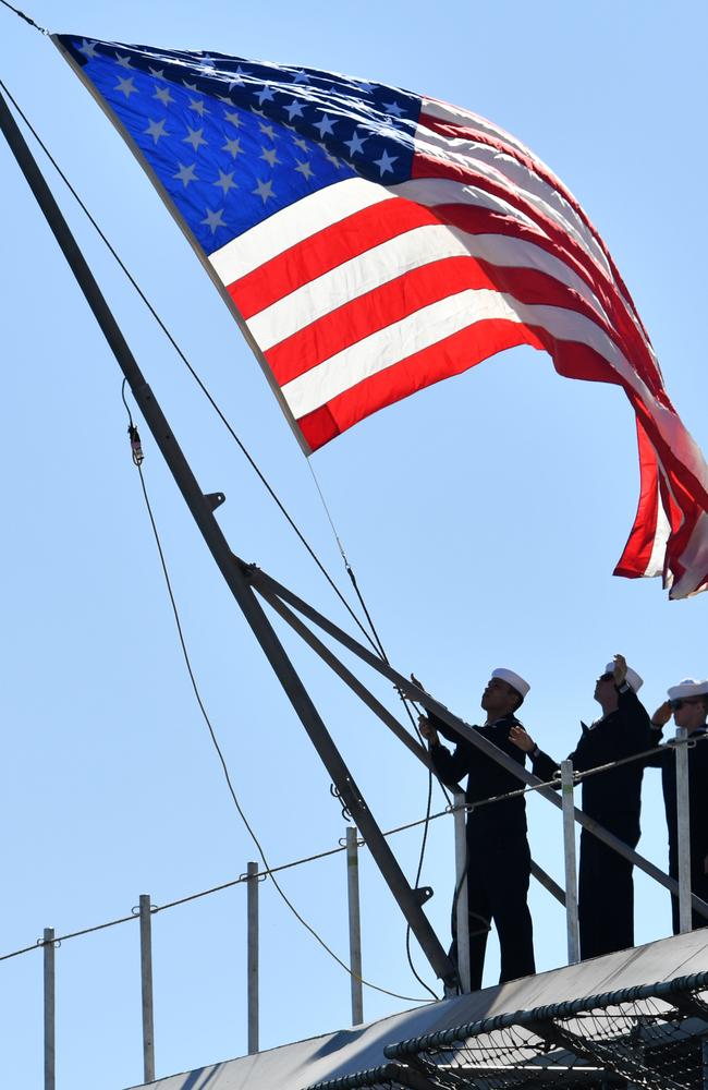 The American flag is raised on the USS Ronald Reagan after it docked at the Port of Brisbane. Picture: AAP