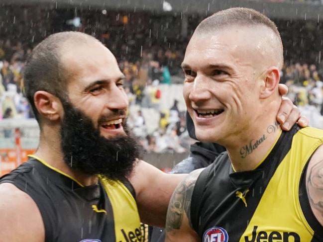 Bachar Houli of the Tigers (L) celebrates the win with Dustin Martin during the Round 22 AFL match between the Richmond Tigers and the West Coast Eagles at the MCG in Melbourne, Sunday, August 18, 2019. (AAP Image/Michael Dodge) NO ARCHIVING, EDITORIAL USE ONLY