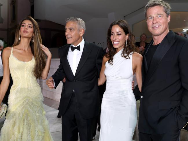 Amal Clooney, George Clooney, Ines de Ramon and Brad Pitt posed together. Picture: Pascal Le Segretain/Getty Images