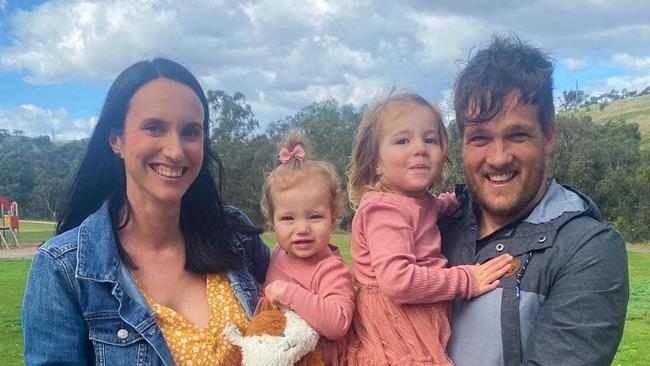 Mitch Williams, 34, with partner Casey and daughters Lila, 3, and Zoe, 1. Picture: Callum Glassford.