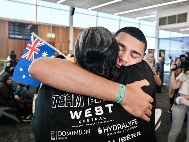 Callum Peters hugs his mum Cassie at Adelaide Airport. Picture: NewsWire / Brenton Edwards