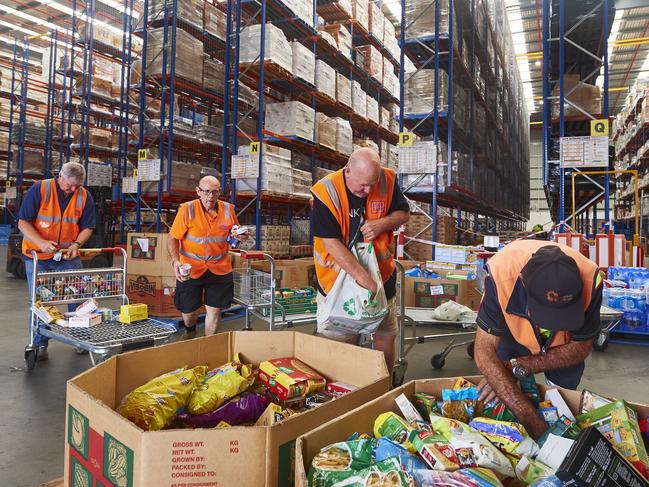 SYDNEY, AUSTRALIA - JANUARY 07: Volunteers help help organise large donations of goods at the Food Bank Distribution Centre bound for areas impacted by bushfires on January 07, 2020 in the Glendenning suburb of Sydney, Australia. Cooler conditions and light rain has provided some relief for firefighters in NSW who continue to battle bushfires across the state. The Federal Government announced the establishment of the National Bushfire Recovery Fund on Monday, with an initial $2 billion to support rebuilding efforts after the devastating bushfires which have burned across Australia in recent months. At least 20 people have died in New South Wales since the start of the fire season, while 1,588 homes have been destroyed and 653 damaged.  (Photo by Brett Hemmings/Getty Images)