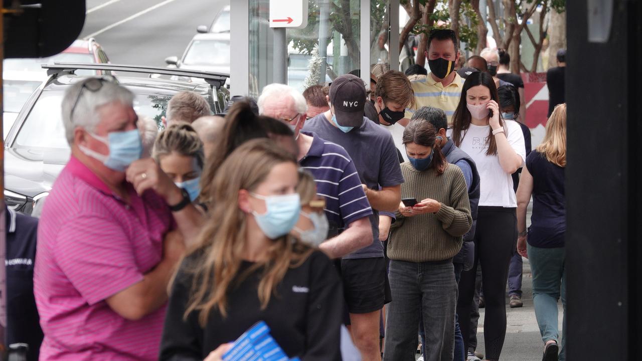 A large queue of people outside a Melbourne pharmacy lining up for RATs. Picture: Alex Coppel.