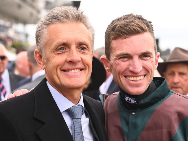 MELBOURNE, AUSTRALIA - NOVEMBER 03: Josh Parr poses with trainer Mark Newnham after riding Joyful Fortune winning Race 6, the G.h. Mumm Century Stakes,  during 2022 Kennedy Oaks Day at Flemington Racecourse on November 03, 2022 in Melbourne, Australia. (Photo by Vince Caligiuri/Getty Images)