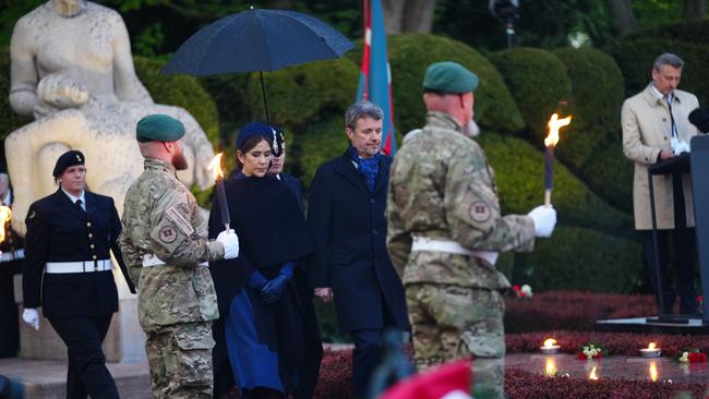 Denmark’s Queen Mary and King Frederik placing a wreath. Picture: AP