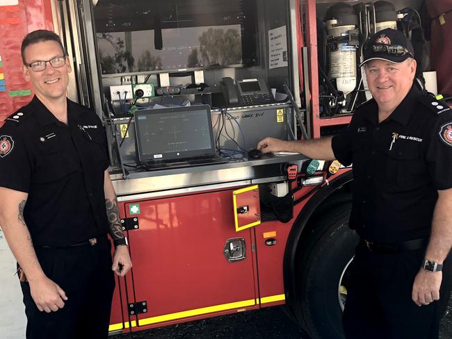 Acting Station Officer Jared Glover and Station Officer Barry Thompson at the staging area on Lakes Creek Road