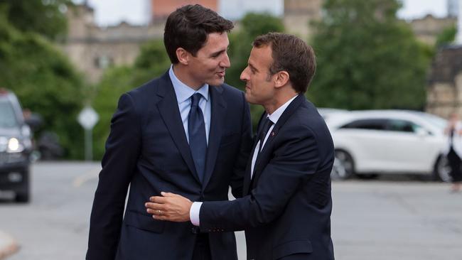 Justin Trudeau, left, greets Emmanuel Macron in Ottawa, Canada. Picture: AFP