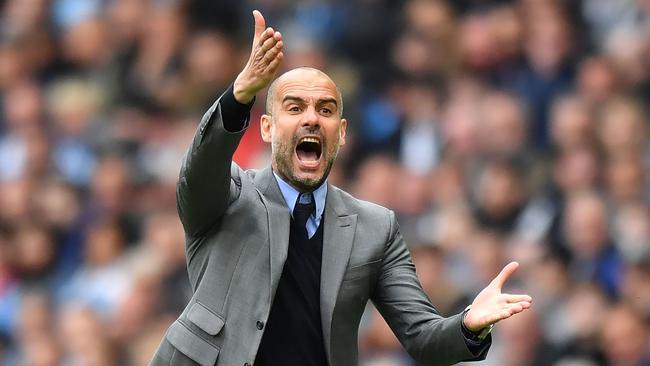 Manchester City's Spanish manager Pep Guardiola gestures on the touchline during the English Premier League football match between Manchester City and Leicester City at the Etihad Stadium in Manchester, north west England, on May 13, 2017. Manchester City won the game 2-1. / AFP PHOTO / Anthony DEVLIN / RESTRICTED TO EDITORIAL USE. No use with unauthorized audio, video, data, fixture lists, club/league logos or 'live' services. Online in-match use limited to 75 images, no video emulation. No use in betting, games or single club/league/player publications.  /