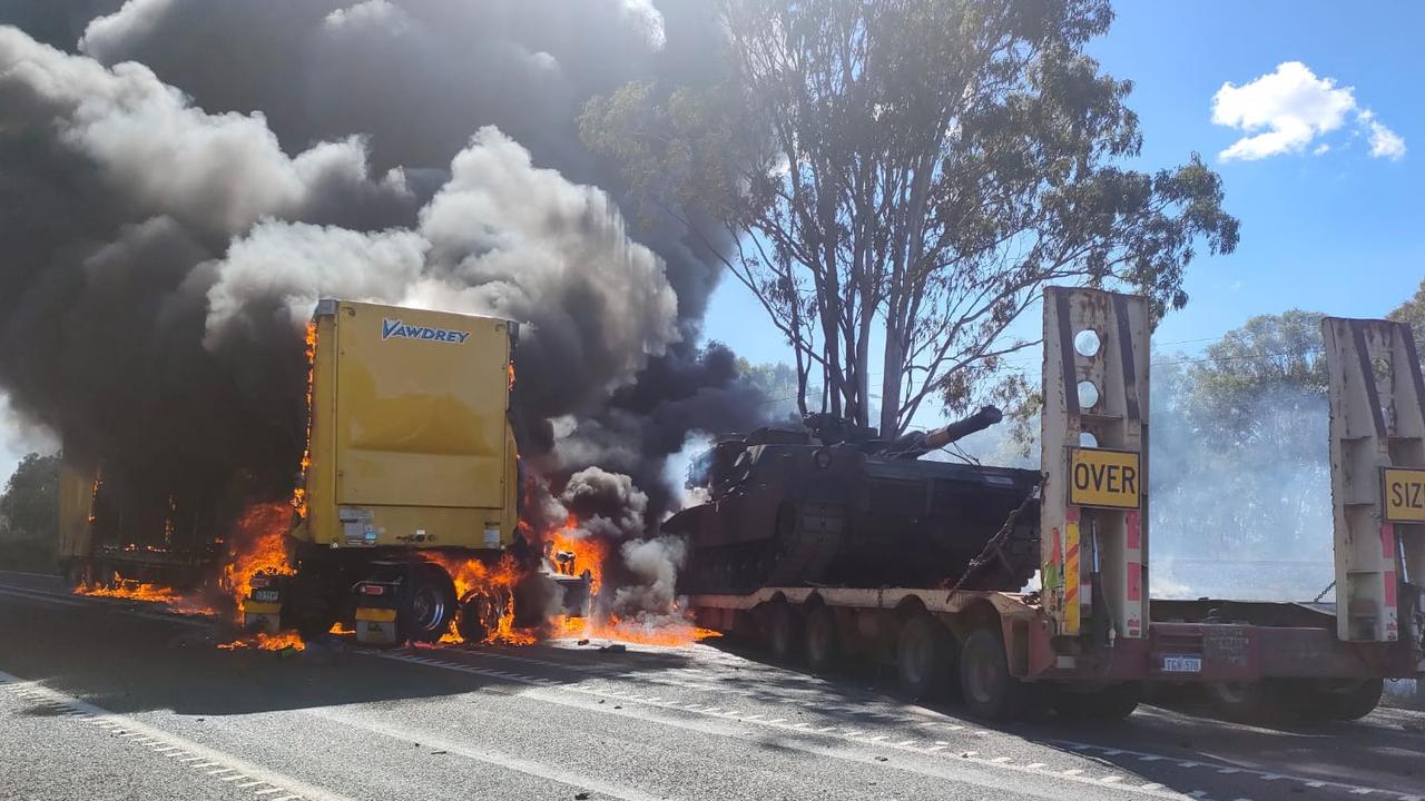 Firey scenes of the Bruce Highway crash at Bajool on Wednesday July 19, involving three trucks, one with an Army tank loaded on the trailer, and four vehicles.