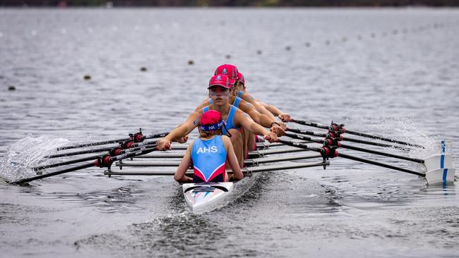 The All Hallows First VIII hard at rowing.