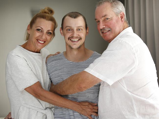 Jessy with his parents Kathy and Tony Carroll. Picture: David Caird