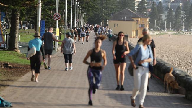 People out and about, exercising and swimming on the Corso and Manly Beach in Manly at the weekend. Picture Rohan Kelly