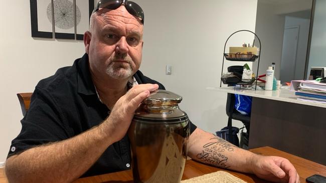 Brett Beasley with his son's urn