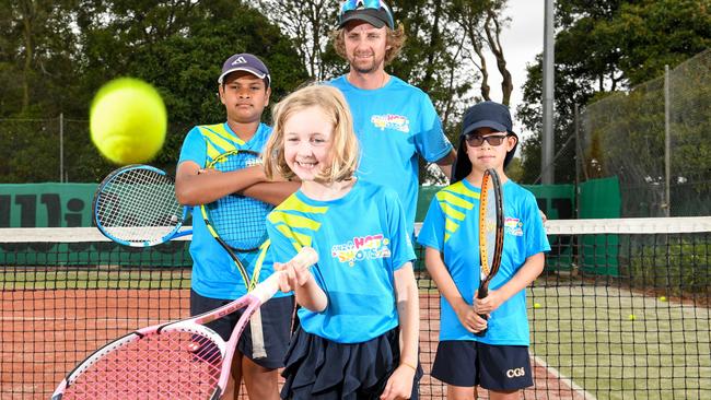 Tennis coach Michael Dracos with young players Chiren Gamolath, Ethan Wang and Imogen Dracos at Lum Reserve Tennis Club. PICTURE: PENNY STEPHENS.