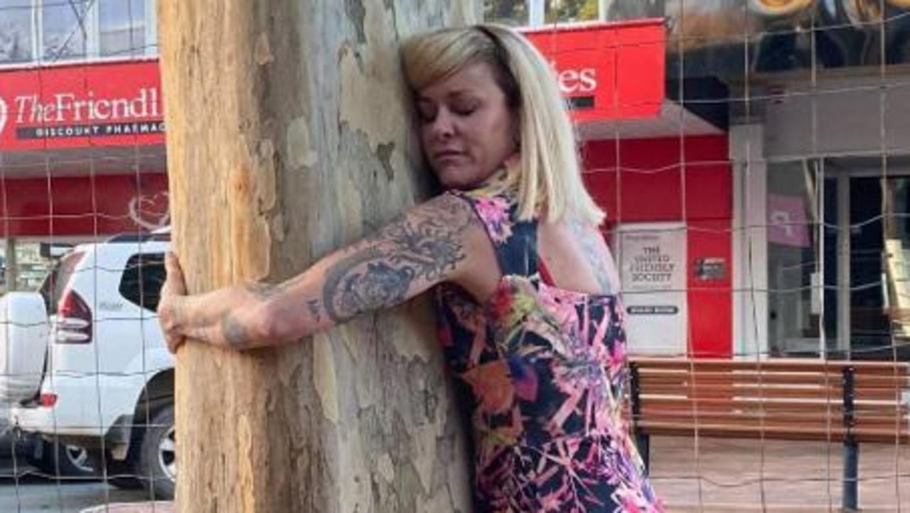 Gympie business owner Stacy Edwards says she will chain herself to two doomed leopard trees as the local council tries to remove them from the CBD on Sunday morning.