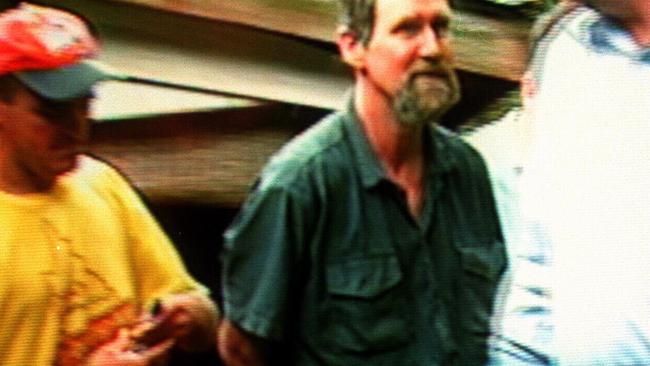 TV news showed William Kelvin Fox being escorted away by police after his recapture.