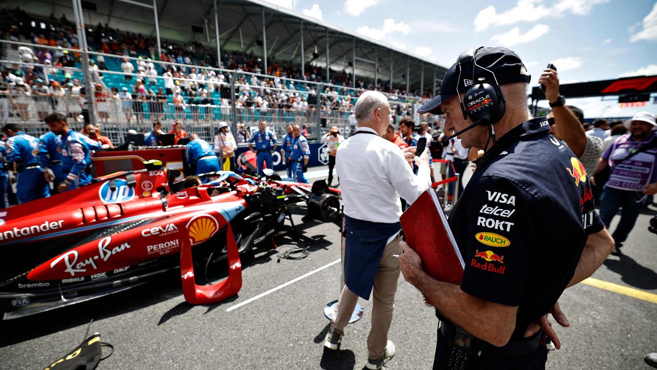 Adrian Newey inspects the car of Charles Leclerc. Photo by Chris Graythen.