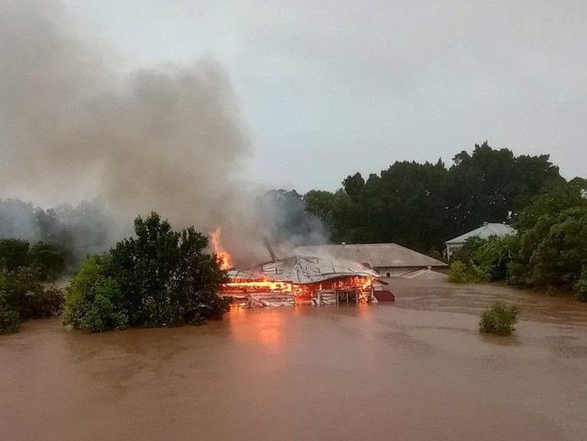 A house in Lismore burst into flames as the residents were rescued via boat in the nick of time. Picture: Facebook