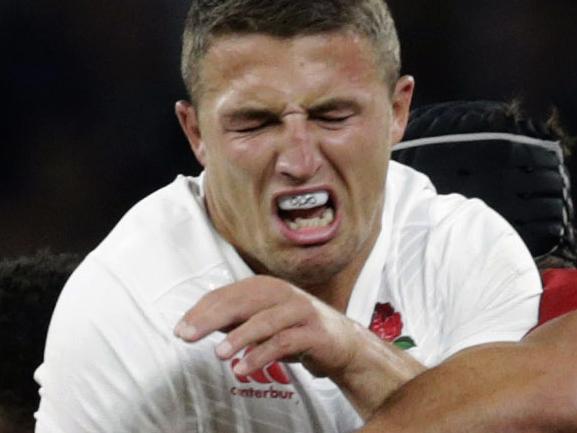 England’s Sam Burgess, centre is tackled by France’s Flugence Ouedraogo, left and France’s Yoann Maestri right, during an international friendly rugby match between England and France at Twickenham stadium in London, Saturday, Aug. 15, 2015. A series of friendly internationals are being held in advance of the upcoming Rugby World Cup that starts in September. (AP Photo/Alastair Grant)