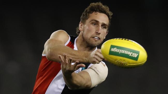 MELBOURNE, AUSTRALIA - JULY 30: Luke Dunstan of the Saints handballs during the round 20 AFL match between St Kilda Saints and Carlton Blues at Marvel Stadium on July 30, 2021 in Melbourne, Australia. (Photo by Darrian Traynor/Getty Images)