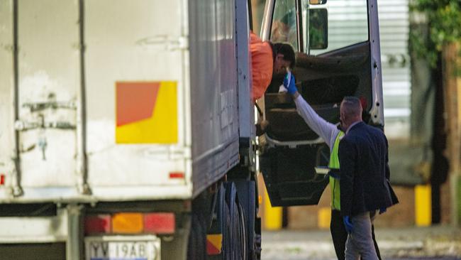 A truck driver arriving at Cedar Meats has his temperature taken. Picture: Getty Images.