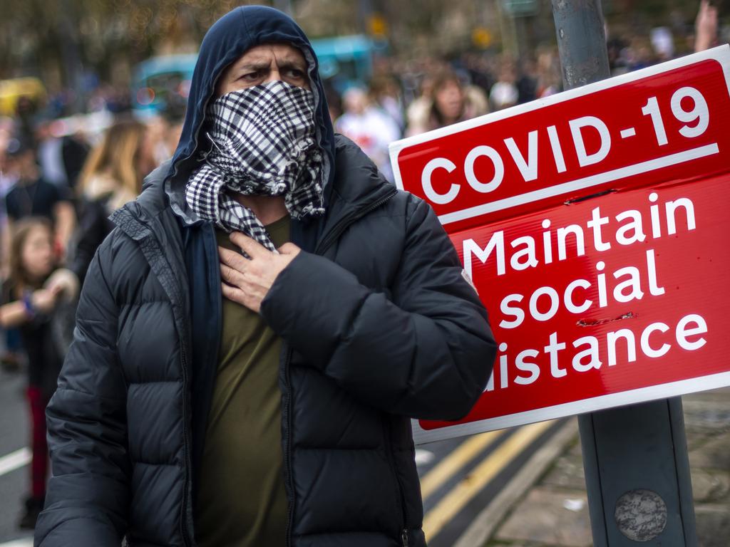 A man wears a scarf as a face covering during an anti-lockdown protest on Saturday in Liverpool, England. Picture: Anthony Devlin/Getty Images