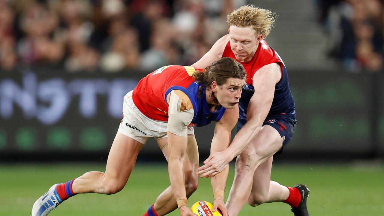 Jarrod Berry of the Lions and Clayton Oliver of the Demons. Picture: Michael Willson