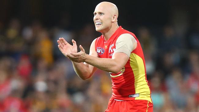 Gary Ablett encourages his Gold Coast teammates.