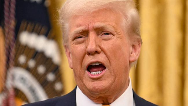 US President Donald Trump speaks during a ceremonial swearing-in for US Secretary of Commerce Howard Lutnick in the Oval Office of the White House in Washington, DC, on February 21, 2025. (Photo by Jim WATSON / AFP)