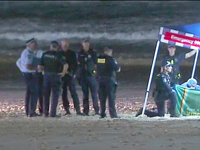 Police at the scene where a Baby body was found on Gold Coast beach - Photo Supplied CH 7