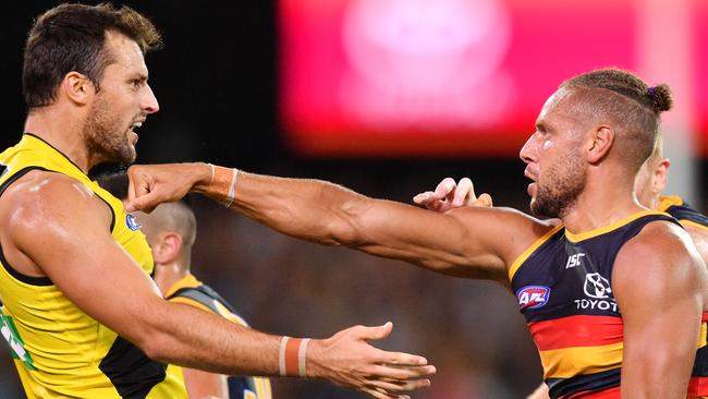 Toby Nakervis of the Tigers confronts Cam Ellis-Yolmen of the Crows.