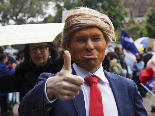 A person attended the Sydney rally dressed as former US president Donald Trump. Picture: Brook Mitchell/Getty Images