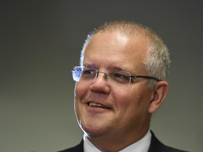 Australian Prime Minister Scott Morrison speaks to the media during a visit to Icon Cancer Centre in Canberra, Monday, April 1, 2019. Scott Morrison announced new Cancer treatment medication to be added to the Pharmaceutical Benefits Scheme (PBS) (AAP Image/Lukas Coch) NO ARCHIVING