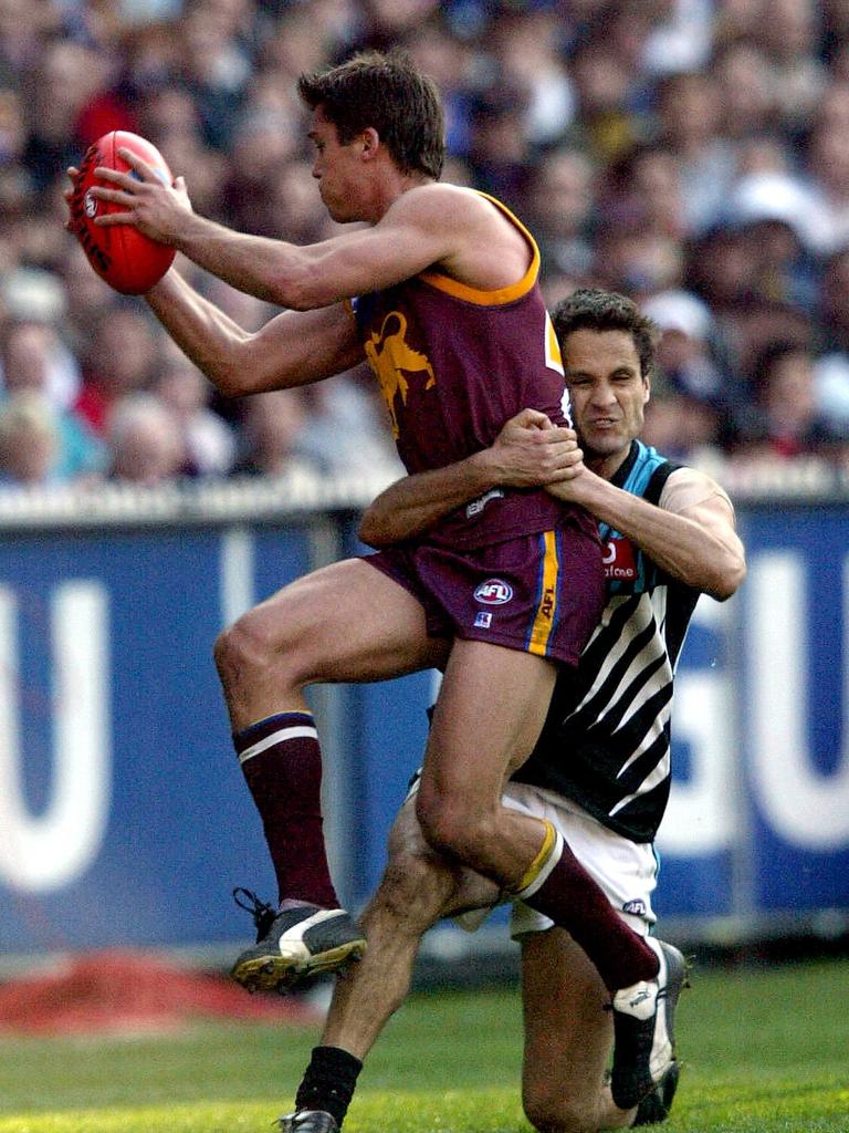 Wanganeen tackles Brisbane’s Simon Black in the 2004 Grand Final.