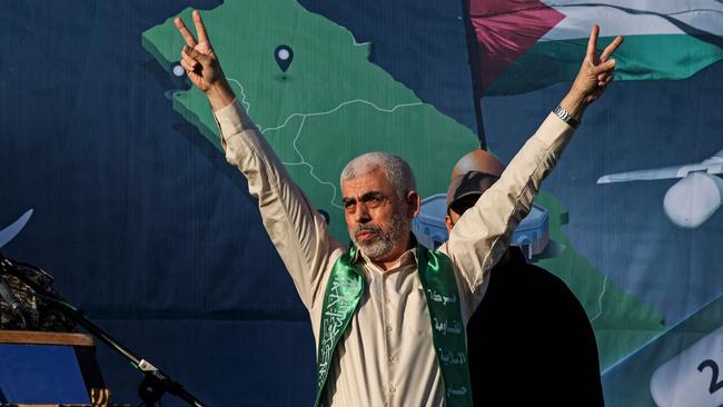 Yahya Sinwar, leader of the Palestinian Hamas movement in the Gaza Strip, gestures on stage during a rally in Gaza City in 2021. Picture: Mahmud Hams / AFP