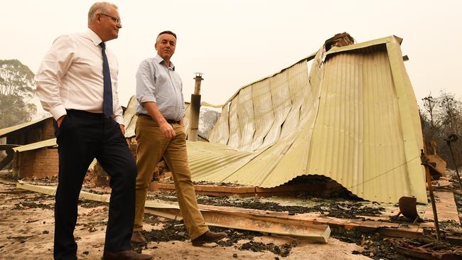 Prime Minister Scott Morrison and Darren Chester visit a farm in Sarsfield, Victoria.