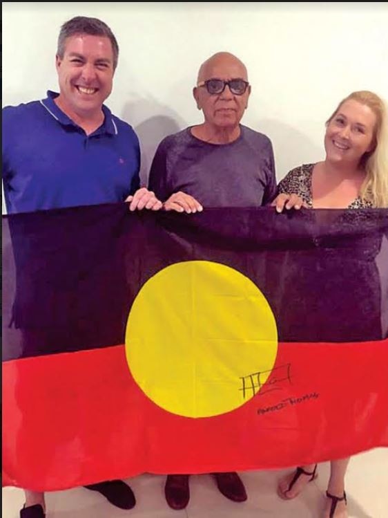 Aboriginal flag creator Harold Thomas (centre) with WAM Clothing owners Ben Wooster (left) and Semele Moore (right).